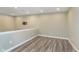 Finished basement with wood flooring and a mount for a flatscreen TV at 16071 Prince Ct, Noblesville, IN 46062