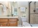 A bright bathroom featuring a vanity and toilet, with modern towel racks on the wall at 16071 Prince Ct, Noblesville, IN 46062