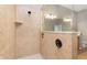 Tiled shower with bronze fixtures in en suite bathroom at 16071 Prince Ct, Noblesville, IN 46062