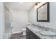 Bathroom with white shower and dark vanity with granite counter at 16071 Prince Ct, Noblesville, IN 46062