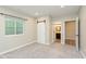 Basement bedroom with neutral paint, gray carpet, and barn door to bath at 16071 Prince Ct, Noblesville, IN 46062