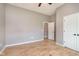 Bedroom featuring hardwood floors, neutral walls, ceiling fan, and a closet, providing a serene and comfortable space at 16071 Prince Ct, Noblesville, IN 46062