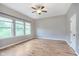 Bright bedroom with natural light, hardwood floors, ceiling fan and three windows at 16071 Prince Ct, Noblesville, IN 46062
