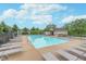 Community pool with lounge chairs and clear blue water for neighborhood residents to enjoy at 16071 Prince Ct, Noblesville, IN 46062