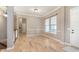 Bright foyer showcasing hardwood floors and trim work along the walls at 16071 Prince Ct, Noblesville, IN 46062