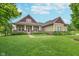 Charming home with a manicured lawn, professional landscaping, and a welcoming front porch at 16071 Prince Ct, Noblesville, IN 46062