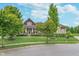 Charming home with a manicured lawn, professional landscaping, and mature trees in a suburban setting at 16071 Prince Ct, Noblesville, IN 46062