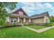 Charming home with a manicured lawn, professional landscaping, and a welcoming front porch at 16071 Prince Ct, Noblesville, IN 46062