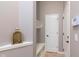Hallway area featuring a built-in bench with storage and neutral decor, providing a stylish and functional entryway at 16071 Prince Ct, Noblesville, IN 46062