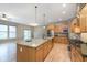 Gourmet kitchen with stainless appliances, large island, and view to the living area at 16071 Prince Ct, Noblesville, IN 46062