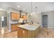 Spacious kitchen featuring a large island, stainless steel appliances, and light wood cabinets at 16071 Prince Ct, Noblesville, IN 46062