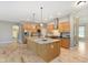 Open kitchen featuring an island, stainless steel appliances, and wood cabinets at 16071 Prince Ct, Noblesville, IN 46062