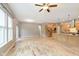 Open living room with stainless steel kitchen and sliding patio door at 16071 Prince Ct, Noblesville, IN 46062