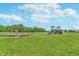 Community playground featuring swings and a slide in a large grassy area on a beautiful, sunny day at 16071 Prince Ct, Noblesville, IN 46062