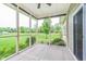 Cozy screened porch offering scenic views of the well-manicured lawn and surrounding greenery at 16071 Prince Ct, Noblesville, IN 46062