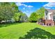Enjoy the spacious backyard with a well-manicured lawn and beautiful landscaping at 16316 Brookhollow Dr, Westfield, IN 46074