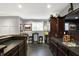 Modern bar area featuring a sink, stylish cabinets, sleek countertops, and seating space for entertaining at 16316 Brookhollow Dr, Westfield, IN 46074