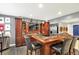 Custom bar area with rich wood cabinets, ample counter space, and stylish seating for casual dining at 16316 Brookhollow Dr, Westfield, IN 46074