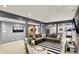 Inviting basement featuring a spacious seating area, striped rug, and an entertainment zone with a TV at 16316 Brookhollow Dr, Westfield, IN 46074