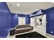 Spacious basement is complete with modern sofa, dark rug, and plenty of lighting at 16316 Brookhollow Dr, Westfield, IN 46074