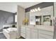 Modern bathroom featuring a soaking tub, vanity, and decorative mirror at 16316 Brookhollow Dr, Westfield, IN 46074