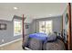 Bedroom showcasing a four-poster bed and plenty of natural light at 16316 Brookhollow Dr, Westfield, IN 46074