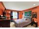Vibrant bedroom featuring a gray bed, sports decor, and a window with dark curtains at 16316 Brookhollow Dr, Westfield, IN 46074