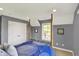Bedroom featuring a four-poster bed, carpet, and an ensuite bathroom at 16316 Brookhollow Dr, Westfield, IN 46074