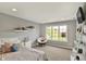 Bright bedroom with a large window, papasan chair, and modern decor at 16316 Brookhollow Dr, Westfield, IN 46074