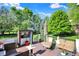 Outdoor deck with comfortable seating, a TV, and stylish decor, ideal for relaxation and entertainment at 16316 Brookhollow Dr, Westfield, IN 46074