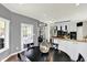 Dining space with natural light, wood floors and a view into the kitchen and other rooms at 16316 Brookhollow Dr, Westfield, IN 46074