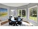 Light-filled dining area with large windows, wood floors, and a modern light fixture at 16316 Brookhollow Dr, Westfield, IN 46074