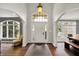 Elegant foyer with soaring ceilings, beautiful hardwood floors, and a stunning chandelier at 16316 Brookhollow Dr, Westfield, IN 46074