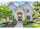 Charming brick home with manicured landscaping, a classic arched entryway, and a neatly paved walkway at 16316 Brookhollow Dr, Westfield, IN 46074