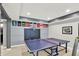 Finished basement with ping pong table and sports decorations at 16316 Brookhollow Dr, Westfield, IN 46074