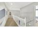 Hallway with carpet, white railings, archways and views to the bedroom at 16316 Brookhollow Dr, Westfield, IN 46074