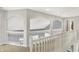 Hallway with white railings, archways, and neutral carpet at 16316 Brookhollow Dr, Westfield, IN 46074