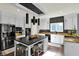 Modern kitchen featuring stainless steel appliances, an island with seating, and granite countertops at 16316 Brookhollow Dr, Westfield, IN 46074