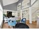 Open-concept living room with vaulted ceilings, upper level walkway, and cozy seating area at 16316 Brookhollow Dr, Westfield, IN 46074