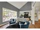 Spacious living room with tall ceilings, large windows, and comfortable blue armchairs at 16316 Brookhollow Dr, Westfield, IN 46074