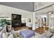 Bright living room features hardwood floors, a fireplace, and a flat-screen television above the mantle at 16316 Brookhollow Dr, Westfield, IN 46074