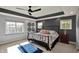 Main bedroom featuring a tray ceiling, neutral carpet, and lots of natural light at 16316 Brookhollow Dr, Westfield, IN 46074