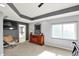 Main bedroom showcasing a tray ceiling, carpet, and view to the bathroom at 16316 Brookhollow Dr, Westfield, IN 46074