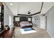 Spacious main bedroom featuring a tray ceiling, neutral carpet, and ample natural light at 16316 Brookhollow Dr, Westfield, IN 46074