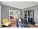 Bright office features a desk and bookcase; an archway offers a view of the dining area and staircase at 16316 Brookhollow Dr, Westfield, IN 46074