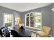 Office space with a black desk, arched window views, and neutral wall colors for a calming atmosphere at 16316 Brookhollow Dr, Westfield, IN 46074