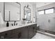 This bathroom offers dual sinks, an enclosed shower, and sleek modern finishes at 17339 Newton Main St, Westfield, IN 46074