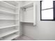 Well-organized walk-in closet with built-in shelving and a window at 17339 Newton Main St, Westfield, IN 46074