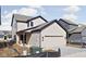 New construction featuring neutral siding, black trim, and a two-car garage at 17339 Newton Main St, Westfield, IN 46074