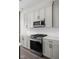 Close up of the kitchen featuring a stainless steel stove and white countertop at 17339 Newton Main St, Westfield, IN 46074